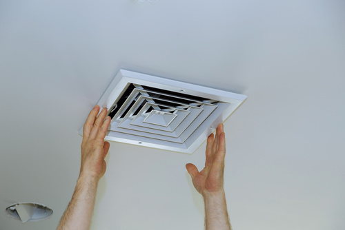 Close Up Man Hand Installing Vent Cover From Ceiling Paul